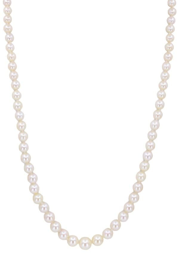 COLLIER DE PERLES EN CHUTE — vue 1