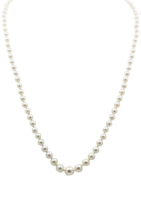 COLLIER DE PERLES EN CHUTE — vue 1