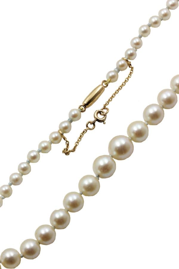 COLLIER DE PERLES EN CHUTE — vue 2